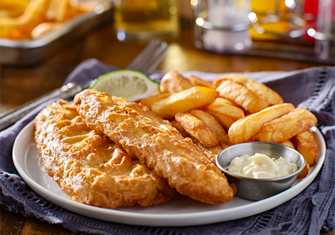  crispy fish & chips with sauce on a plate served at Marinis Takeaway in Motherwell 
