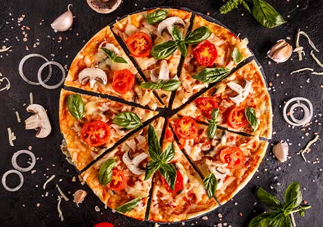 freshly baked pizzas with tomato and basil on a plate served at Marinis Takeaway in Motherwell 